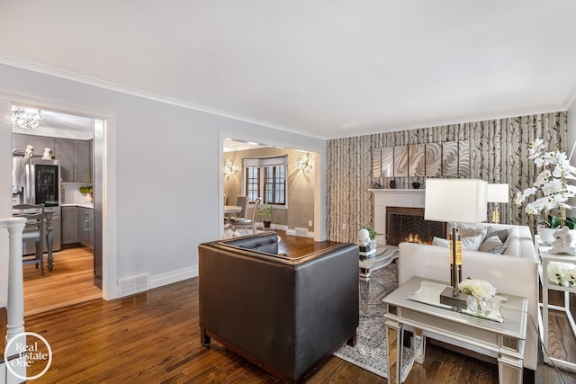 living room featuring crown molding and hardwood / wood-style flooring