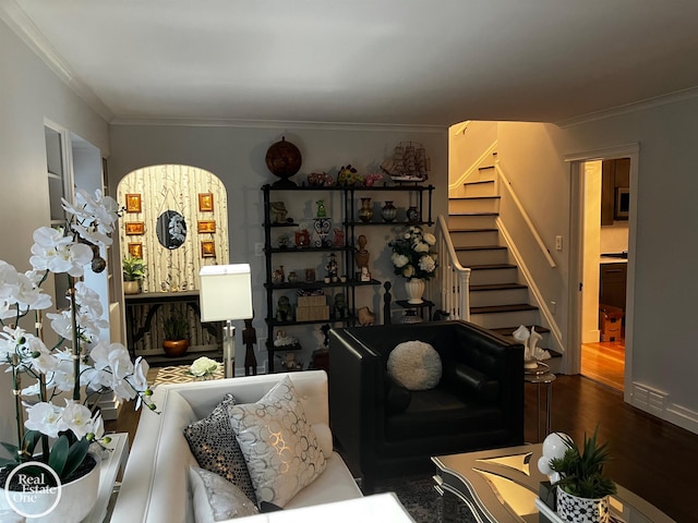 living room with wood-type flooring and crown molding