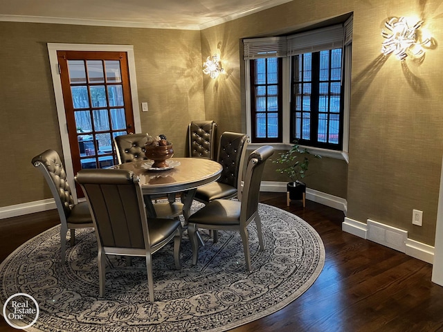 dining space with crown molding and dark wood-type flooring