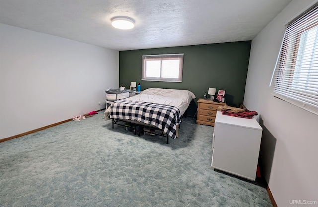 carpeted bedroom with a textured ceiling