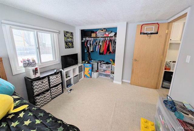 bedroom with light colored carpet, a closet, and a textured ceiling