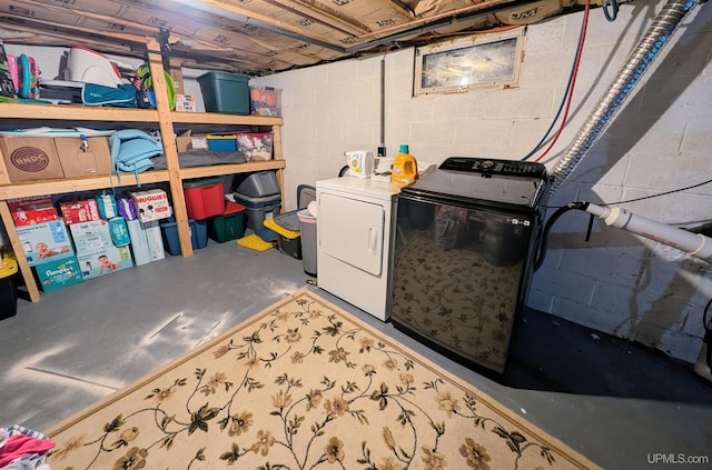 clothes washing area featuring independent washer and dryer