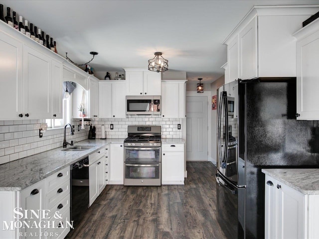 kitchen with white cabinets, light stone countertops, sink, and black appliances