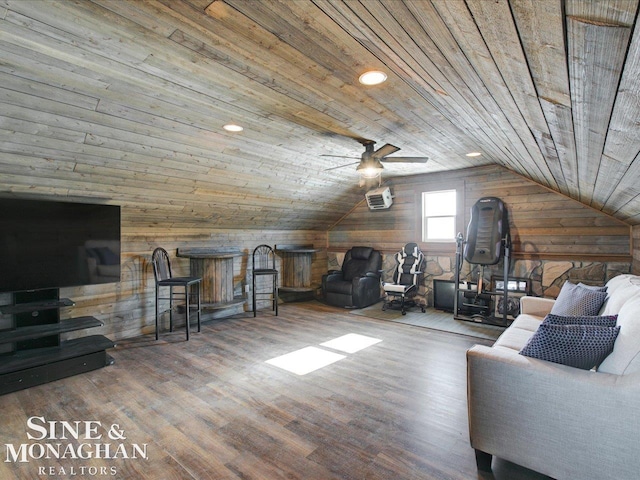 living room with vaulted ceiling, an AC wall unit, wood walls, wood-type flooring, and wooden ceiling