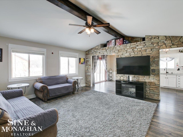 living room with lofted ceiling with beams, sink, dark wood-type flooring, and ceiling fan