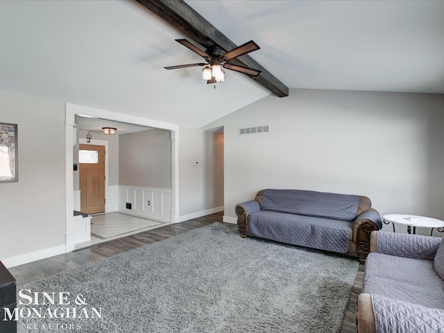 living room featuring dark hardwood / wood-style flooring, lofted ceiling with beams, and ceiling fan