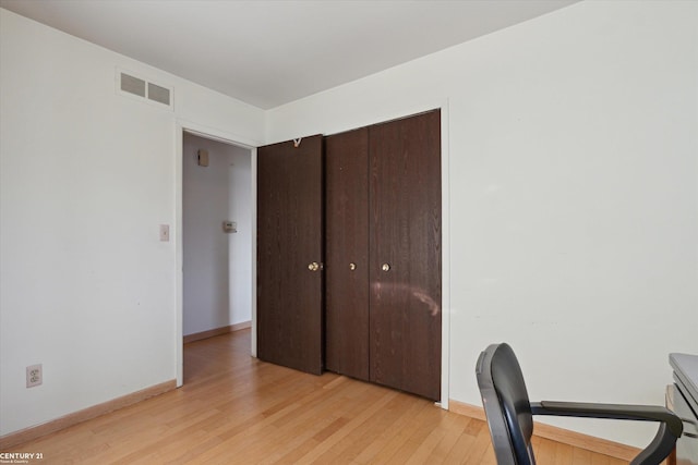 unfurnished office with light hardwood / wood-style floors