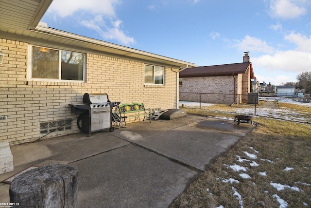 view of patio featuring cooling unit and area for grilling