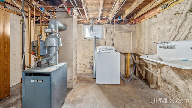 utility room with washer / dryer and sink