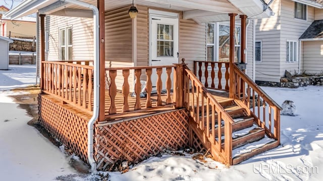 view of snow covered deck