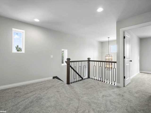 interior space featuring an inviting chandelier and carpet