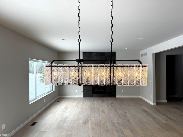 unfurnished dining area with wood-type flooring