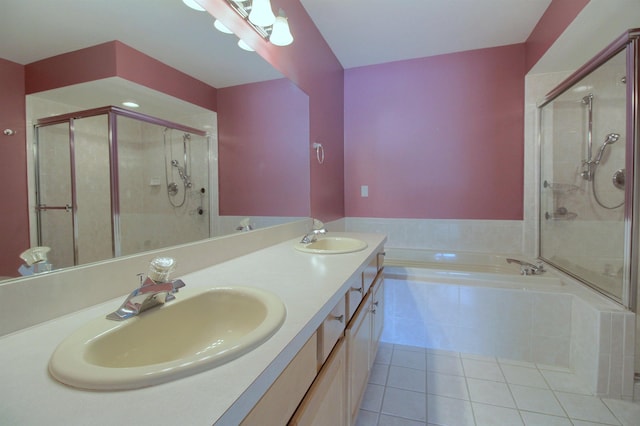 bathroom with independent shower and bath, vanity, and tile patterned floors