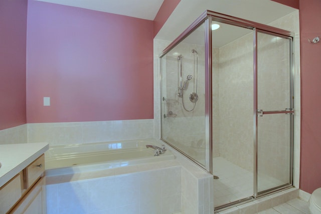 full bathroom with vanity, tile patterned flooring, plus walk in shower, and toilet