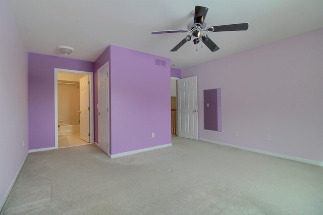 unfurnished bedroom with light colored carpet and ceiling fan