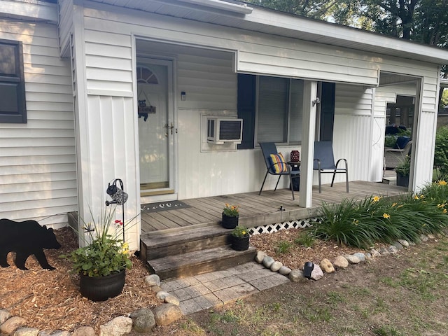 property entrance featuring an AC wall unit