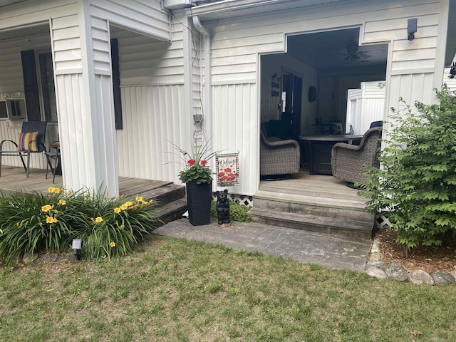 doorway to property featuring a yard