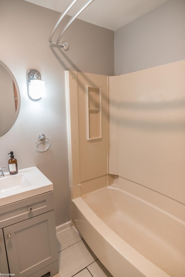 bathroom with tile patterned floors, vanity, and shower / bathing tub combination