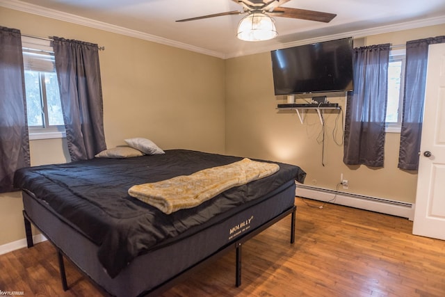 bedroom featuring crown molding, a baseboard radiator, wood-type flooring, and ceiling fan