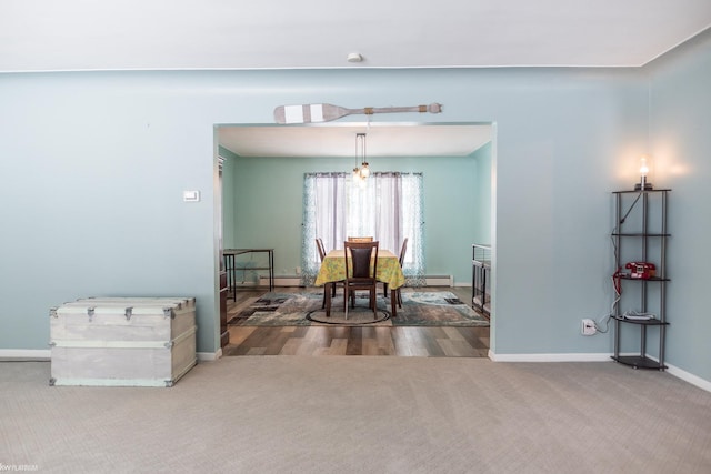 view of carpeted dining area