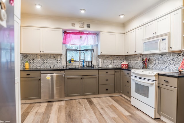 kitchen featuring sink, light hardwood / wood-style flooring, gray cabinets, white appliances, and white cabinets