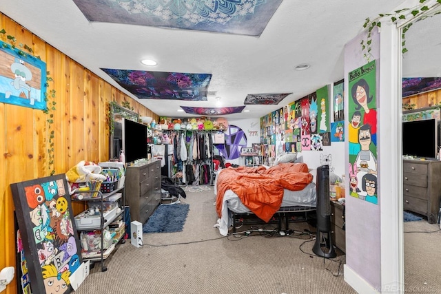 carpeted bedroom with wooden walls