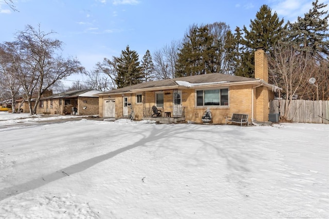 ranch-style home featuring central AC