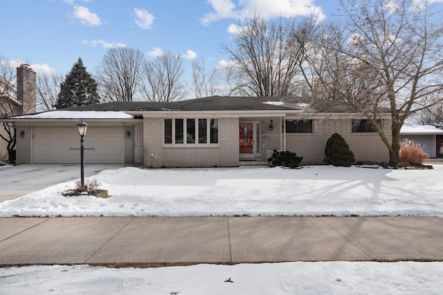 ranch-style house featuring a garage