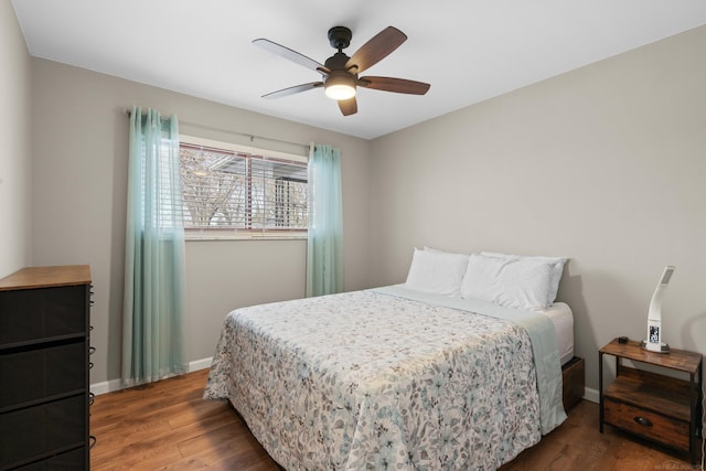 bedroom featuring dark hardwood / wood-style flooring and ceiling fan