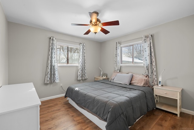 bedroom featuring hardwood / wood-style flooring and ceiling fan