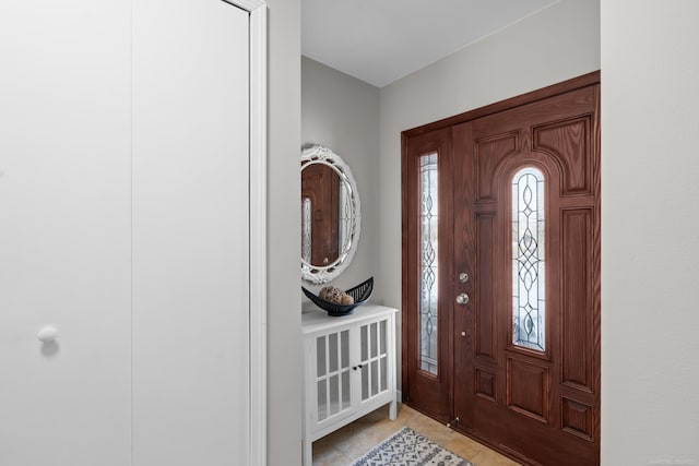 tiled foyer entrance with plenty of natural light