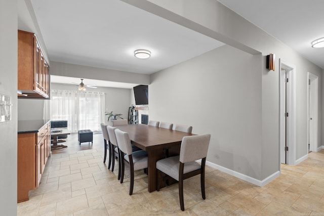 dining space featuring ceiling fan