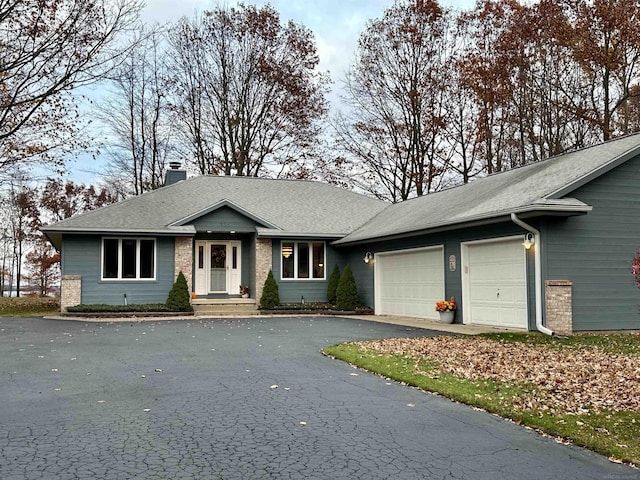 ranch-style home with a garage