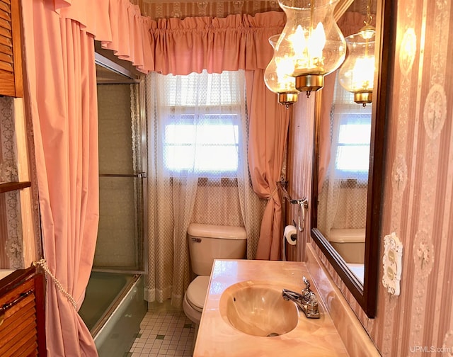 full bathroom featuring tile patterned flooring, vanity, bathing tub / shower combination, and toilet