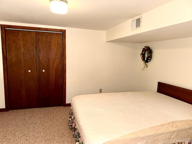 carpeted bedroom featuring a closet