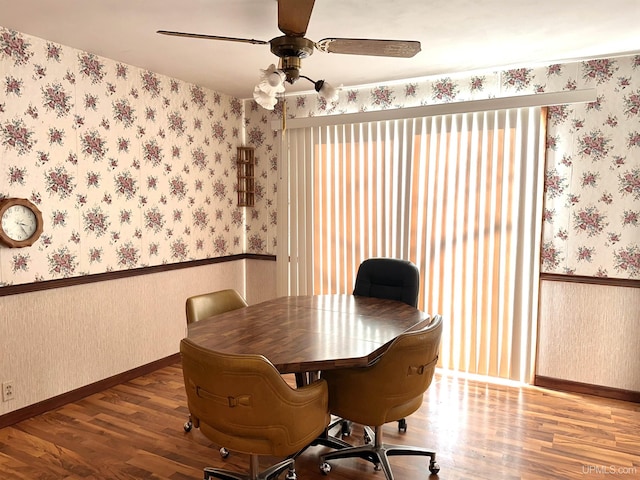 dining room with ceiling fan and hardwood / wood-style floors