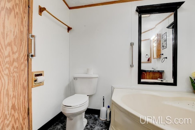 bathroom with crown molding and toilet