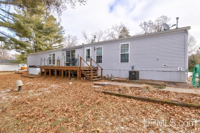 back of house featuring a deck