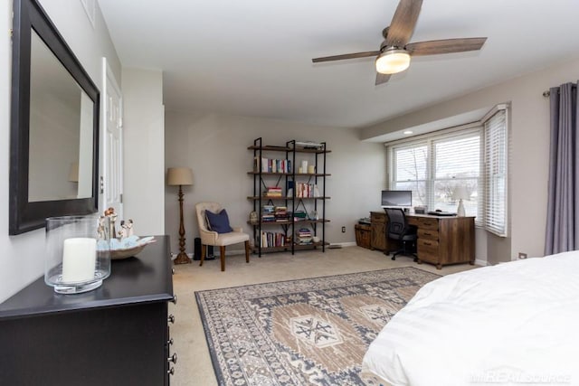 carpeted bedroom with ceiling fan