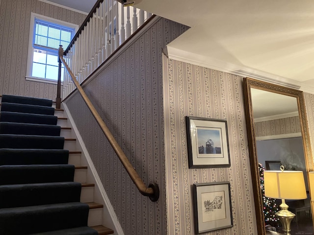 stairway featuring crown molding