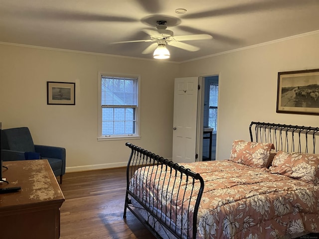 bedroom with ornamental molding, dark wood-type flooring, and ceiling fan