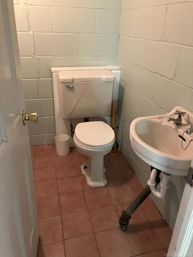 bathroom with sink, tile patterned floors, and toilet