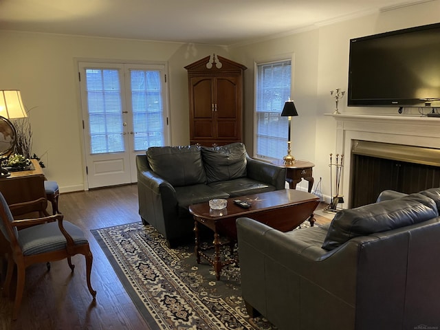 living room with ornamental molding and dark hardwood / wood-style flooring