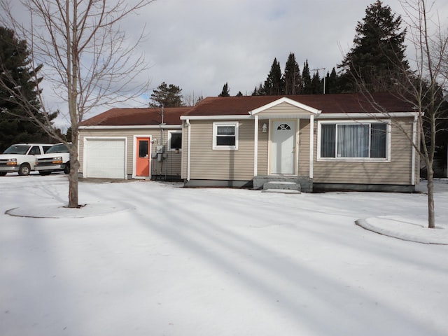 ranch-style home with a garage