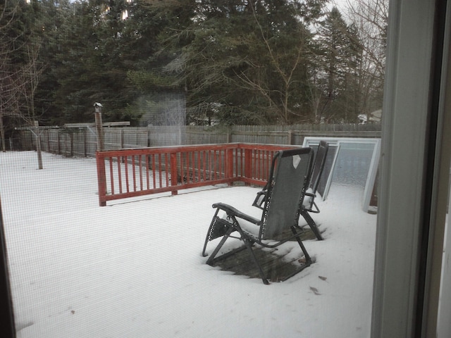 view of snow covered deck