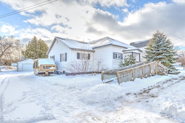 view of front of property featuring an outbuilding and a garage