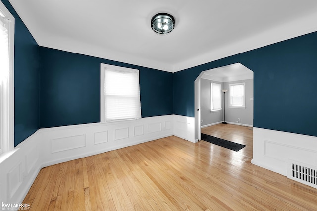 spare room featuring wood-type flooring