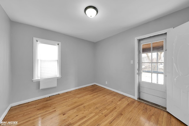 empty room with light wood-type flooring