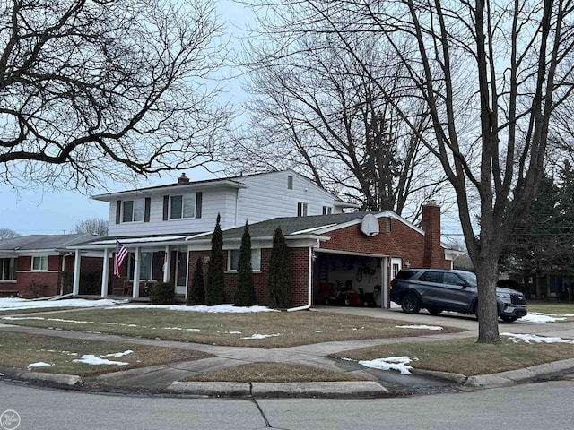 view of front of home with a garage and a porch