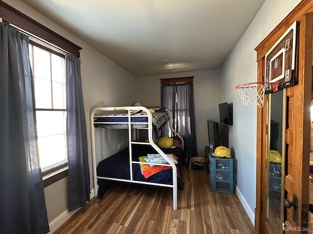 bedroom featuring dark hardwood / wood-style flooring